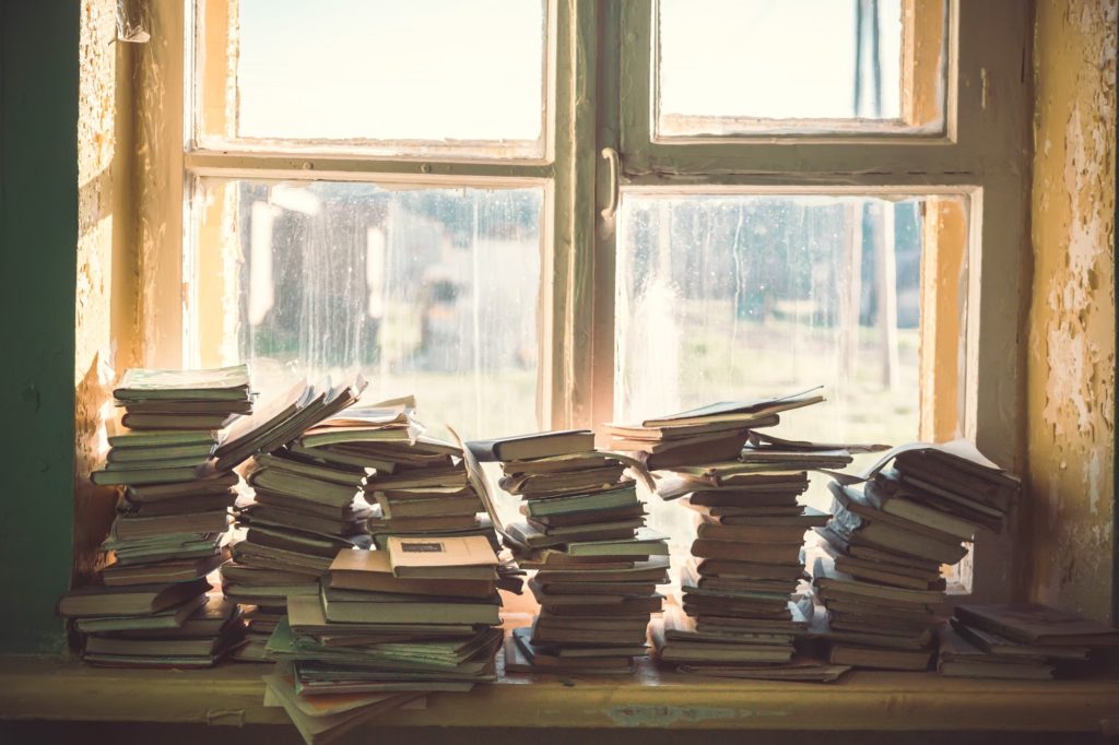 Stack of books by the window