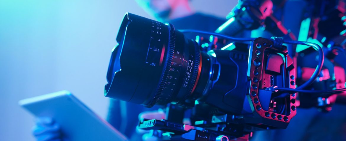 Camera crew with professional camera in studio